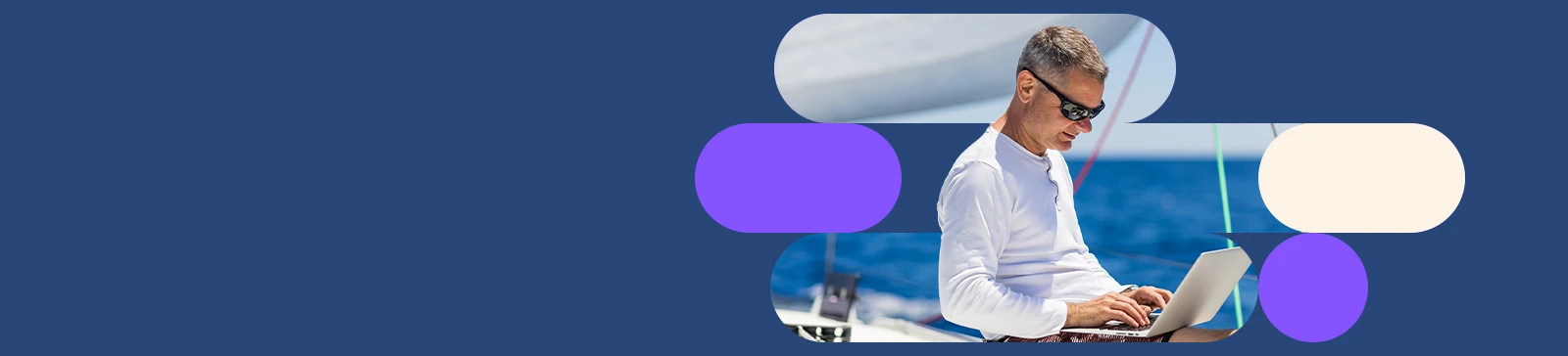 Man using a laptop on a boat